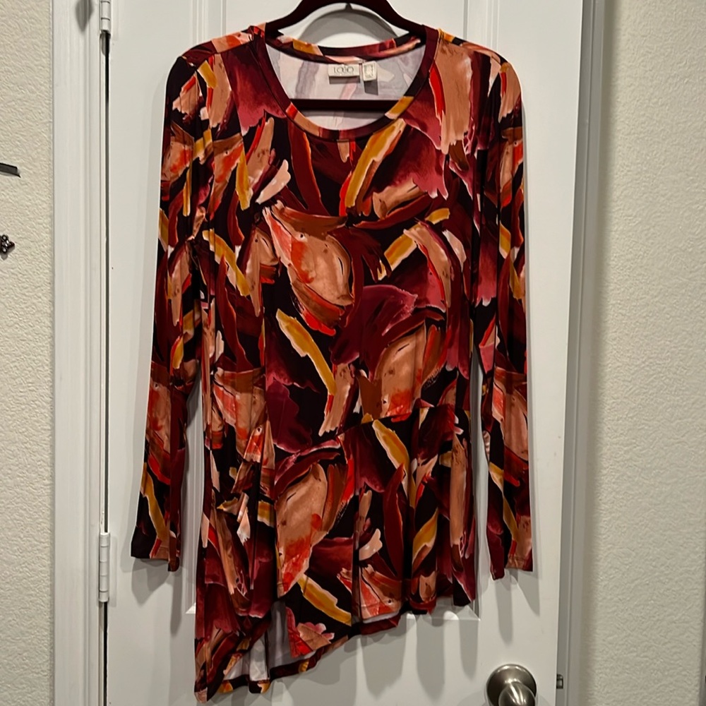 NWOT. Ladies asymmetrical tunics LOGO. Multi colored print. Size Medium.
